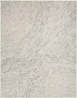 Close-up of the DKNY Pure Angles Grey rug. Handmade pile with a modern, geometric pattern in gray tones.