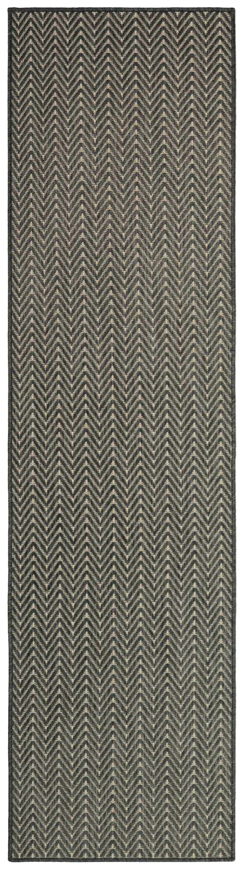 Close-up of the Nourison Horizon Charcoal rug, showcasing its taupe and charcoal chevron pattern and textured weave.