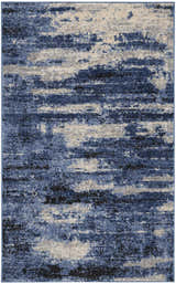 Close-up of Calvin Klein River Flow Blue Grey rug, featuring a modern abstract pattern and soft, plush texture.