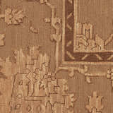 Close-up of the vintage design and texture of the Nourison Silk Pointe Brown Area Rug, handmade with New Zealand wool.