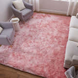 Living room scene with a blush pink Feizy Indochine rug, gray armchairs, and a white sofa. Roomscene-Rectangle