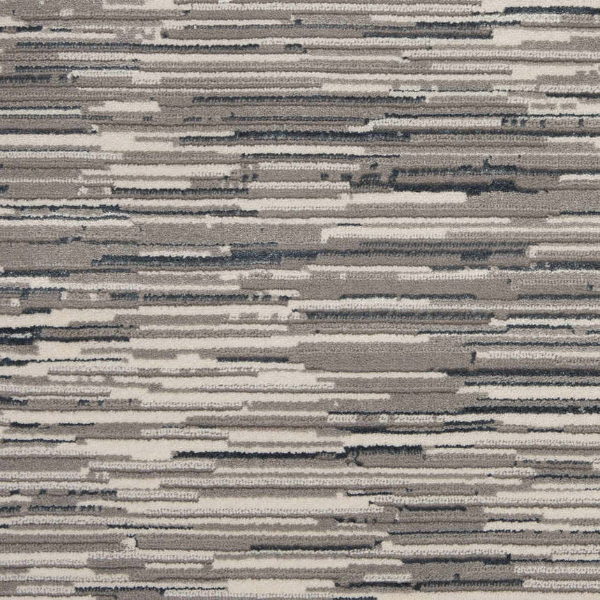 Close-up of the Michael Amini MA90 Uptown Grey Ivory rug. Modern design with horizontal stripes in shades of grey, ivory, and charcoal.