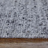 Close-up of the Feizy Finley Gray/Ivory Area Rug showing its hand-knotted texture and subtle color variations. Pile