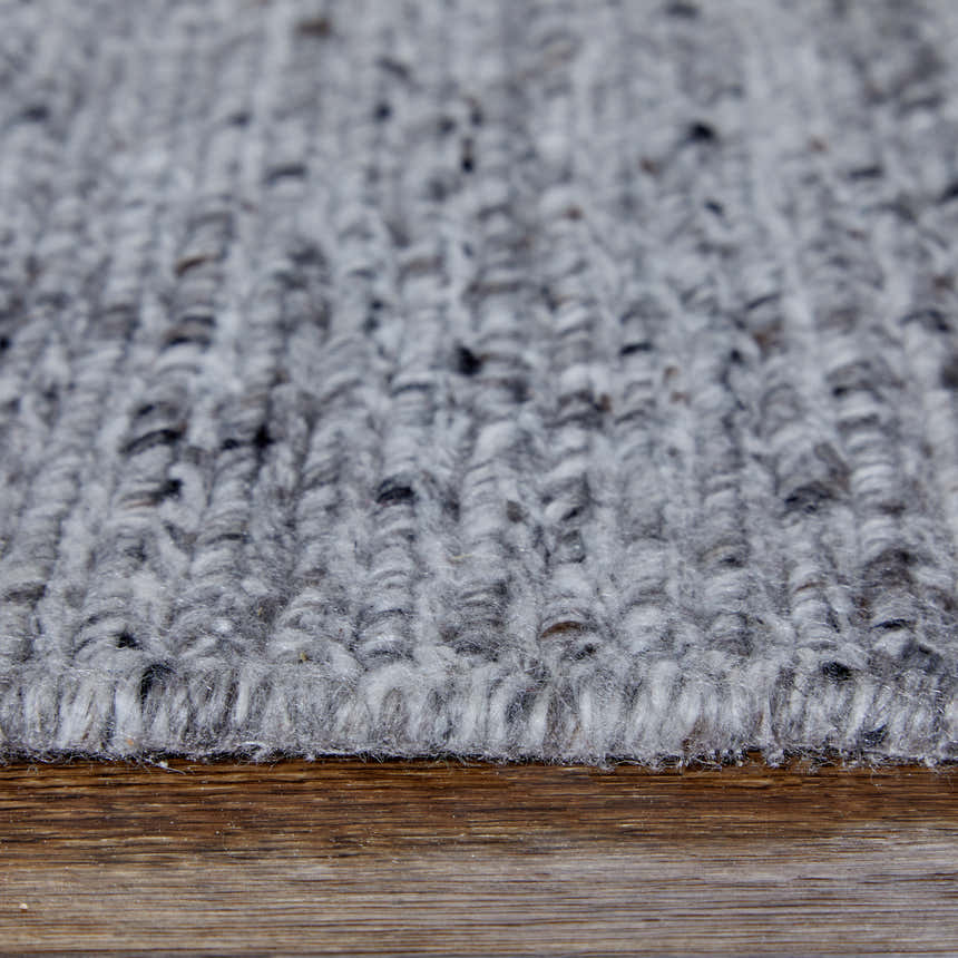 Close-up of the Feizy Finley Gray/Ivory Area Rug showing its hand-knotted texture and subtle color variations. Pile