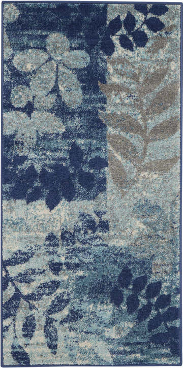 Close-up of the Nourison Tranquil Navy/Light Blue rug featuring a floral and leaf pattern.