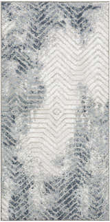 Close-up of the Nourison Dekor Grey Navy rug featuring a modern chevron pattern and high pile texture.