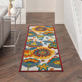 Hallway with Nourison Aloha Multicolor rug runner, floral pattern, wood floors, console table.