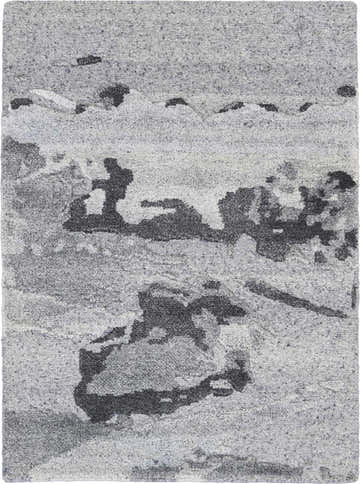 Close-up of the Nourison Divine Smoke Rug, a gray mid-century modern rug with abstract black pattern and handmade texture.