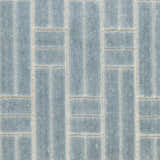 Close-up of Nourison Charm Blue Ivory Rug, featuring a modern geometric pattern and soft texture.