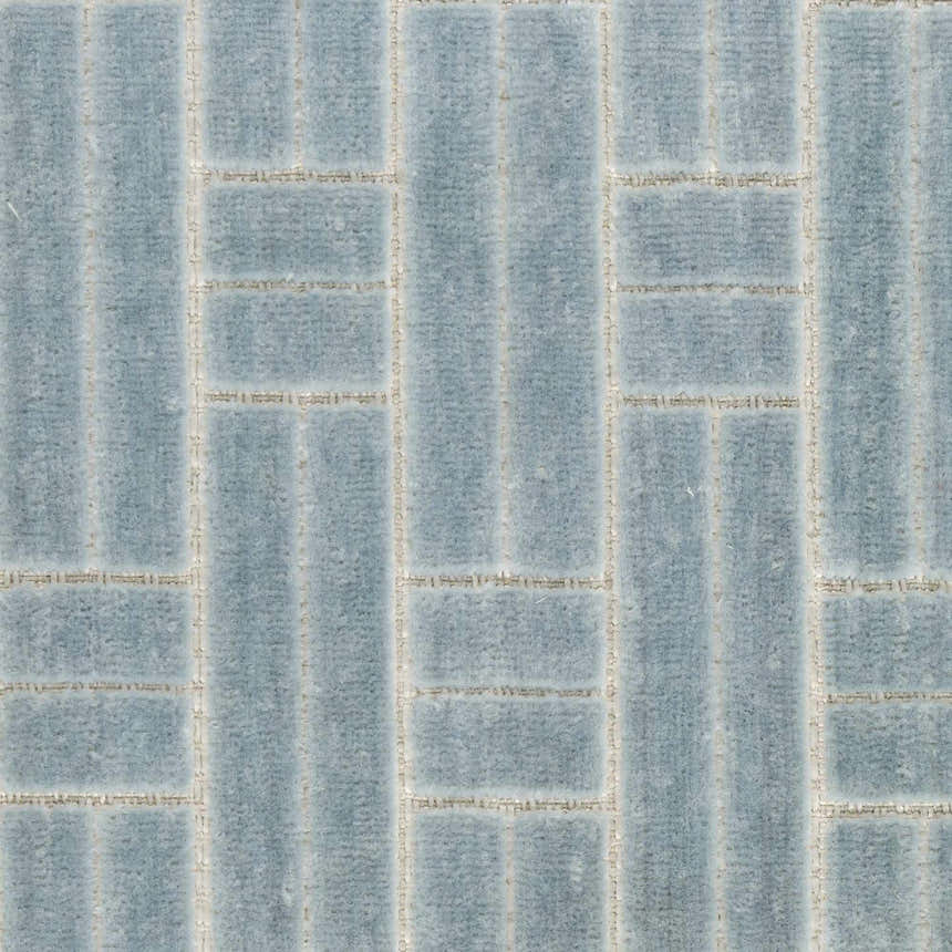 Close-up of Nourison Charm Blue Ivory Rug, featuring a modern geometric pattern and soft texture.