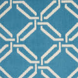 Close-up of the Nourison Jubilant Blue rug featuring a geometric trellis pattern in light blue and white.
