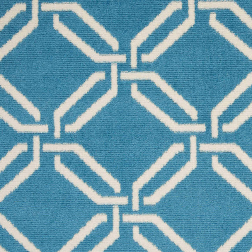 Close-up of the Nourison Jubilant Blue rug featuring a geometric trellis pattern in light blue and white.
