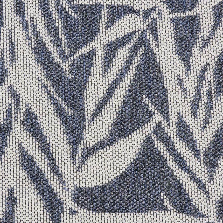 Close-up of the Nourison Aruba Slate/Cream rug. Beach style rug with a slate blue and cream geometric leaf pattern.