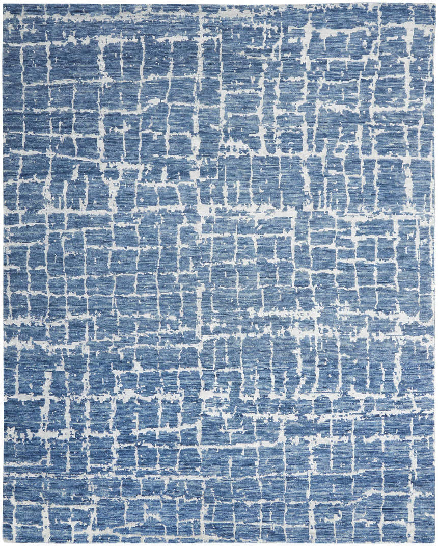 Close-up of the Nourison Luna Blue Silver rug showing its abstract grid pattern and textured wool and rayon blend.