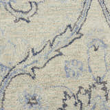 Close-up of the Nourison Jazmine Ivory/Blue Persian rug showing wool texture and floral pattern.