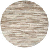 Close-up of round Nourison Elation Ivory Grey rug. Chestnut, ivory, and grey horizontal striations. High pile texture.