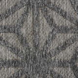 Close-up of the textured, geometric pattern on the Nourison Cozumel Dark Grey Modern Area Rug.