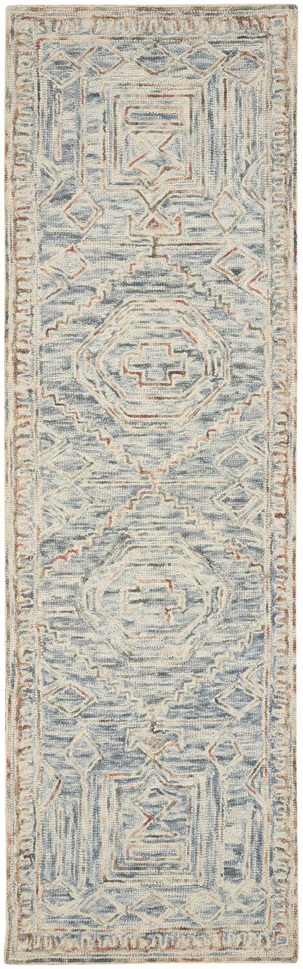 Close-up of the Nourison Interlock Blue Multicolor rug. Features a geometric, bohemian pattern and wool texture.