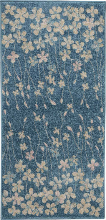 Close-up of Nourison Tranquil Turquoise rug. Aqua rug with a floral pattern in beige and pink. Contemporary style.