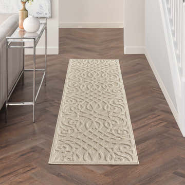Hallway with cream Nourison Cozumel runner rug, farmhouse style. Wood floors, console table, neutral decor.