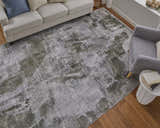 Living room scene with a gray sofa and Feizy Cadiz Gray/Green Ikat rug on hardwood floors. Roomscene-Rectangle