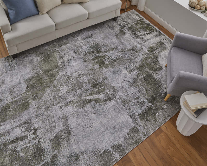 Living room scene with a gray sofa and Feizy Cadiz Gray/Green Ikat rug on hardwood floors. Roomscene-Rectangle