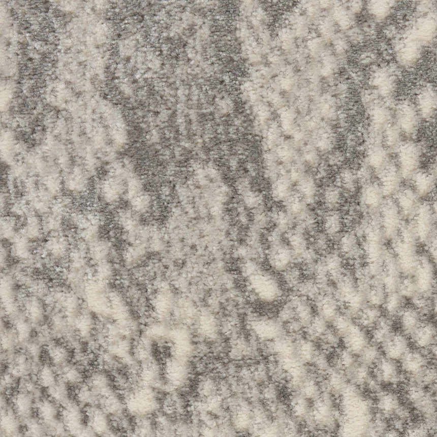Close-up of the high-pile Nourison Solace Ivory/Grey rug, showing its soft texture and abstract, modern pattern.