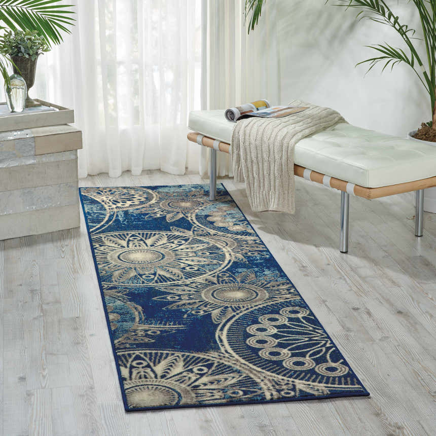 Bright sunroom with a Nourison Somerset Denim Modern Indoor Area Rug runner and white mid-century bench.