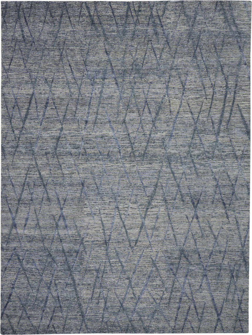 Close-up of the Nourison OCEAN Indigo Area Rug. Handmade rug with a modern geometric diamond pattern. Purple tones.