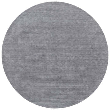 Close-up of a round Feizy Luna Modern Solid rug in gray and blue. Hand-woven wool rug with subtle texture. Design-Round-65