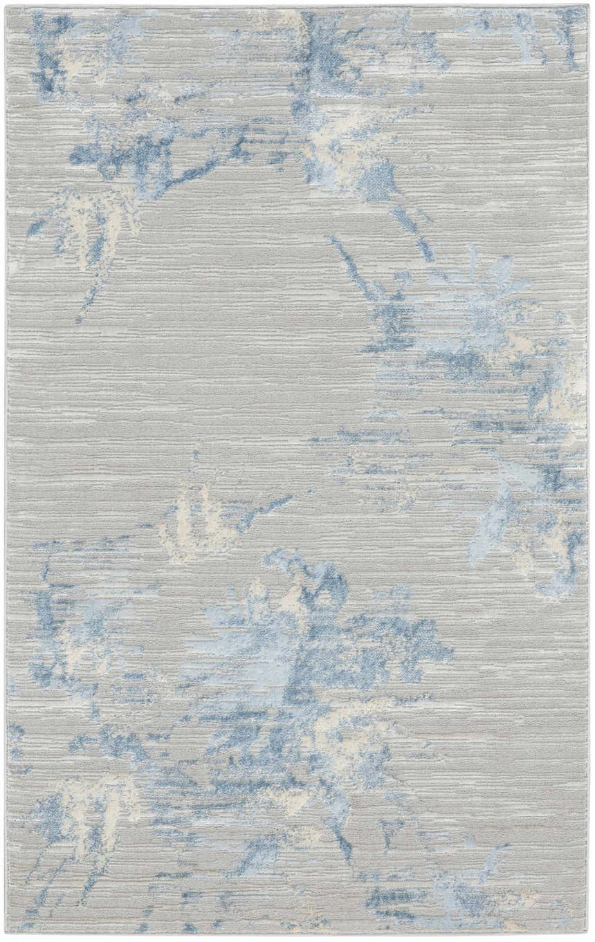 Close-up of the Calvin Klein CK005 Enchanting Grey Sky rug. Abstract blue and ivory pattern on a textured gray high pile.