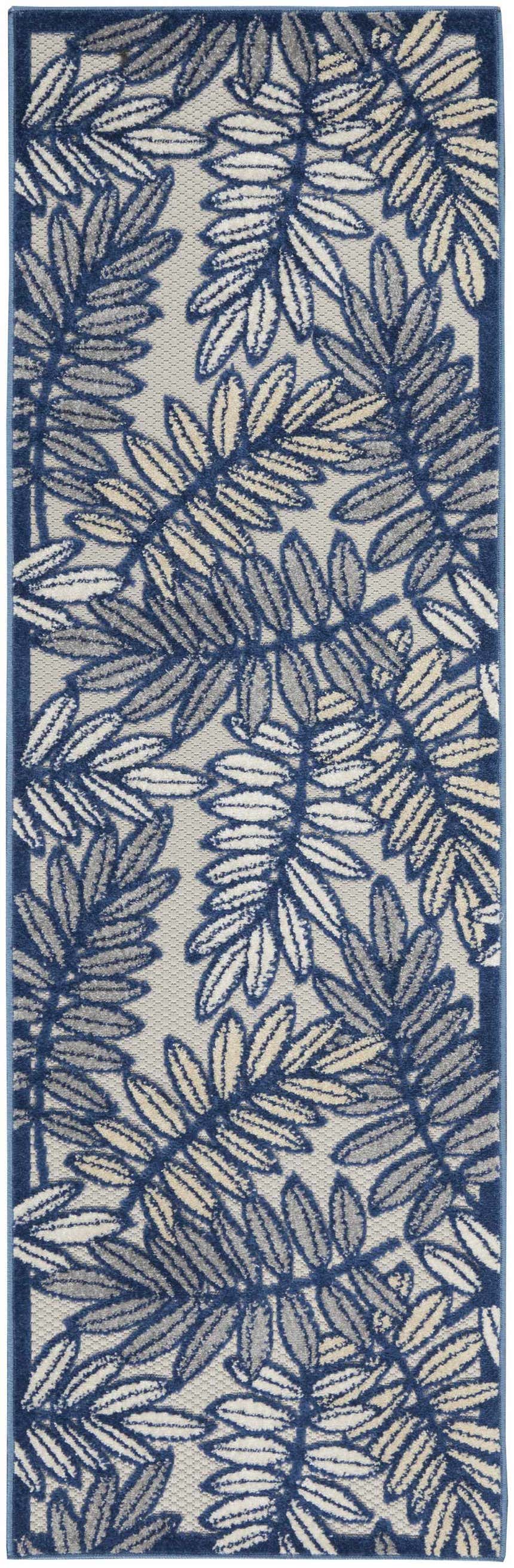 Close-up of the Nourison Aloha Ivory Navy Tropical Area Rug featuring a blue and beige leaf pattern.