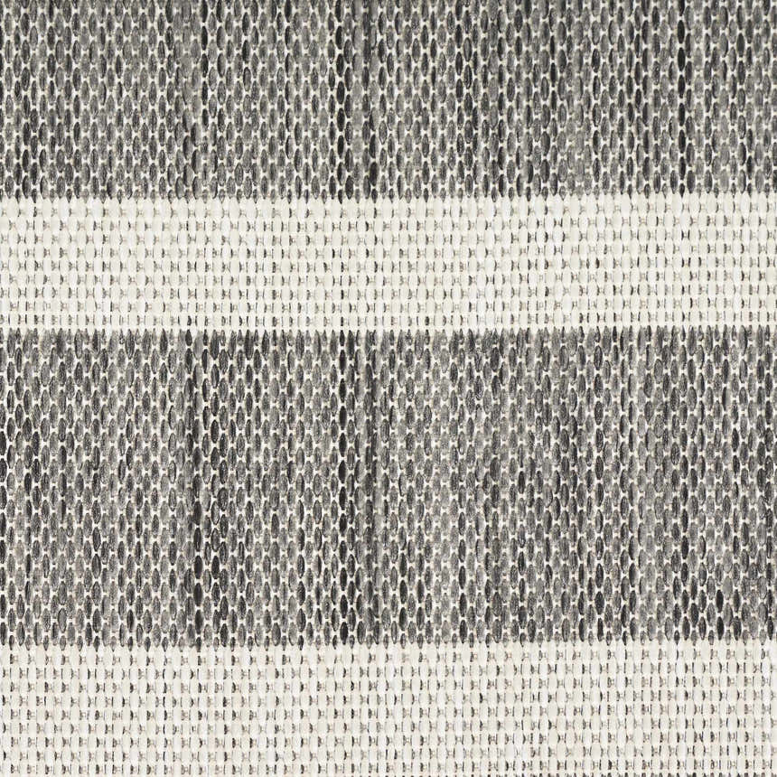 Close-up of the woven texture of the Nourison Positano Charcoal Ivory rug with taupe and ivory stripes.