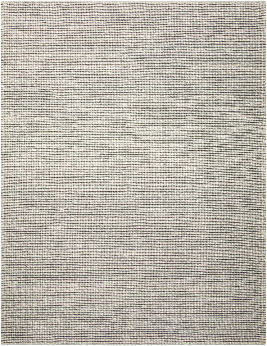 Close-up of Calvin Klein Home Lowland Basalt Rug. Handmade wool rug with a subtle horizontal stripe pattern.