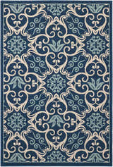 Close-up of Nourison Caribbean Navy Contemporary Area Rug featuring floral and scroll pattern in navy, cream, and light blue.