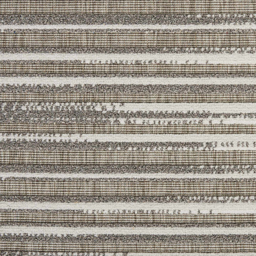 Close-up of the Nourison Key Largo Light Grey rug. Features a contemporary striped pattern in gray and white.