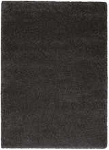 Close-up of the plush texture of a Nourison Malibu Dark Grey Shag Indoor Area Rug.