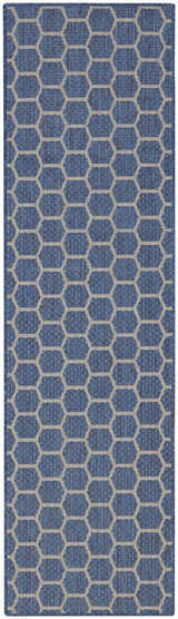 Close-up of the Nourison Twist Reversible Blue Modern Area Rug featuring a blue and gray geometric honeycomb pattern.