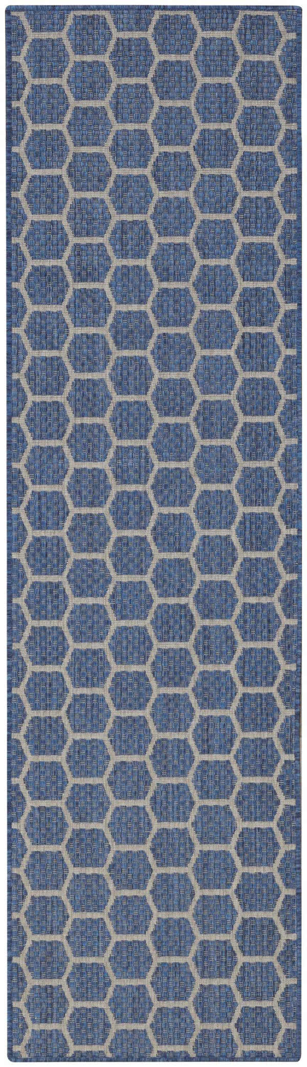 Close-up of the Nourison Twist Reversible Blue Modern Area Rug featuring a blue and gray geometric honeycomb pattern.