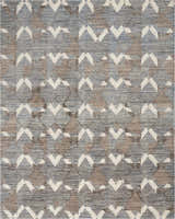 Close-up of Portfolio Catherine & Justine Macfee Ice Blue rug. Features geometric diamond pattern in blue, brown, and white.