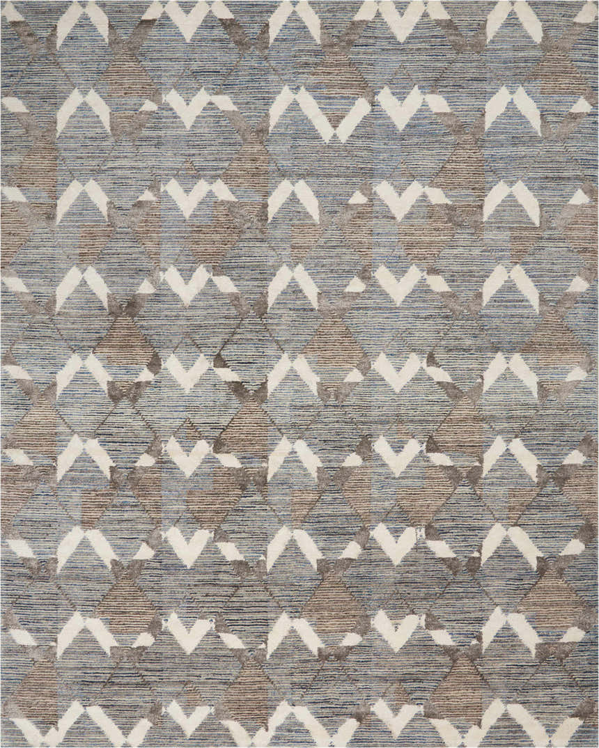 Close-up of Portfolio Catherine & Justine Macfee Ice Blue rug. Features geometric diamond pattern in blue, brown, and white.