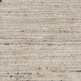 Close-up of the handmade Nourison OCEAN Sand Modern Indoor Area Rug, showing texture and sandstone color.