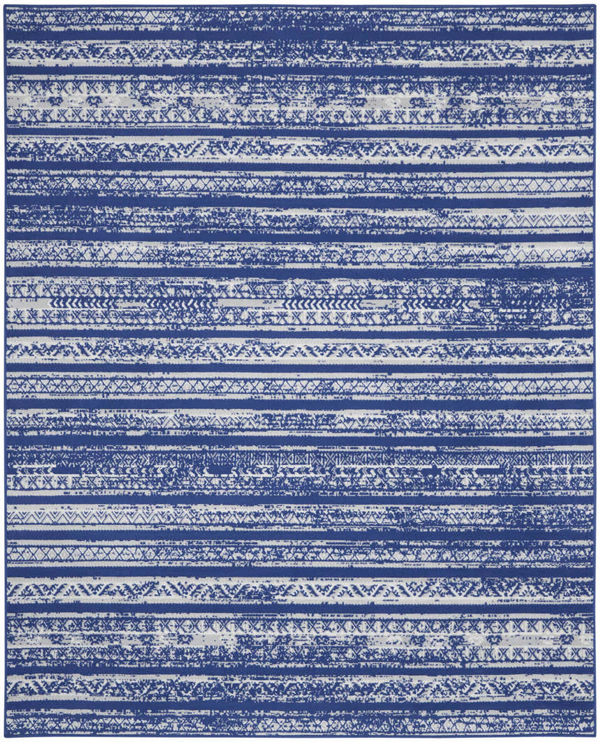 Close-up of Nourison Whimsicle Navy Ivory Bohemian rug featuring a distressed stripe pattern.