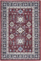 Close-up of Nourison Fulton Red Vintage Indoor Area Rug featuring a distressed, geometric pattern and red, blue, and beige tones.