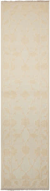 Close-up of Nourison Silk Pointe Ivory Vintage Runner Rug. Floral pattern in subtle chestnut tones. Handmade wool rug texture.