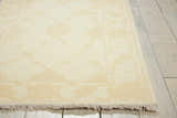 Close-up of Nourison Silk Pointe Ivory Vintage rug showing floral pattern, fringe, and New Zealand wool texture.