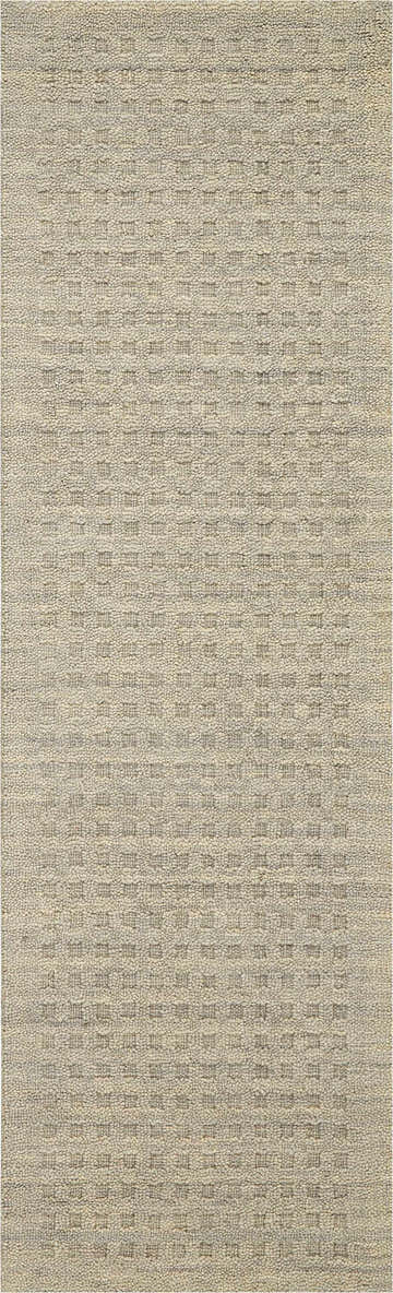 Close-up of the Nourison Marana Taupe rug. Contemporary design with ivory tones and a subtle geometric pattern. Handmade wool texture.