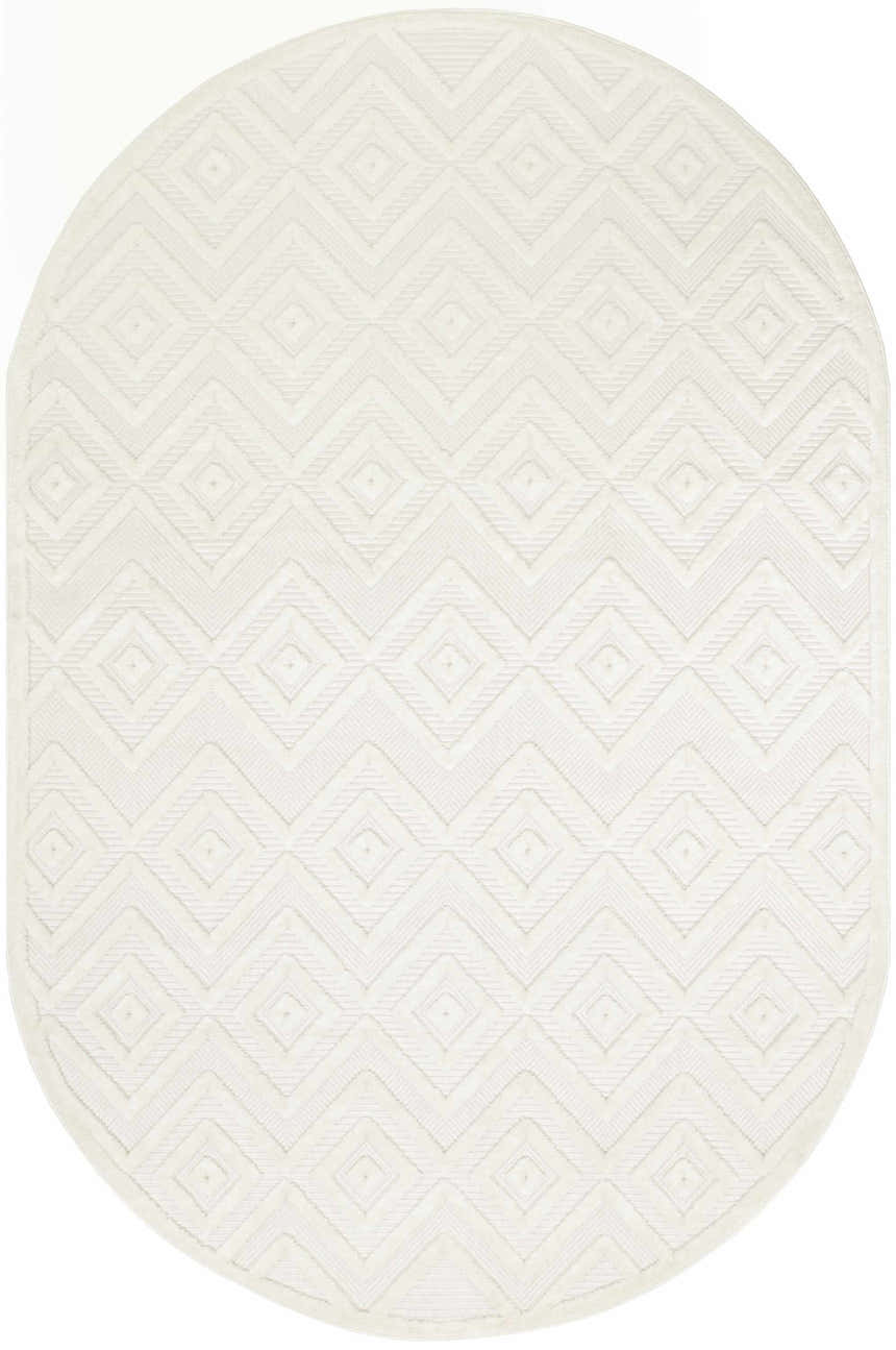 Close-up of an oval Nourison Versatile Ivory White rug. Features a subtle geometric diamond pattern and soft texture.
