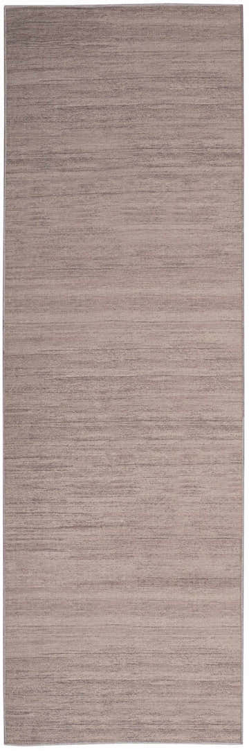 Close-up of the Nourison Essentials Natural Modern Indoor Washable Area Rug in brick red, featuring a subtle horizontal pattern.