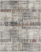 Close-up of the Nourison Tangra Multicolor rug. Features distressed stripes in white, gray, black, and rust colors.
